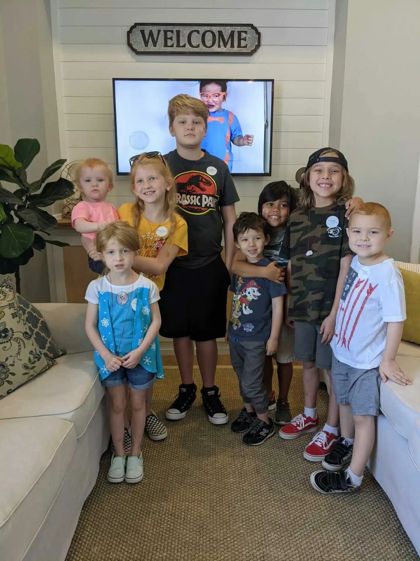 Group of happy kids in the welcoming area of Southern Style Dental, ready for their dental check-up.