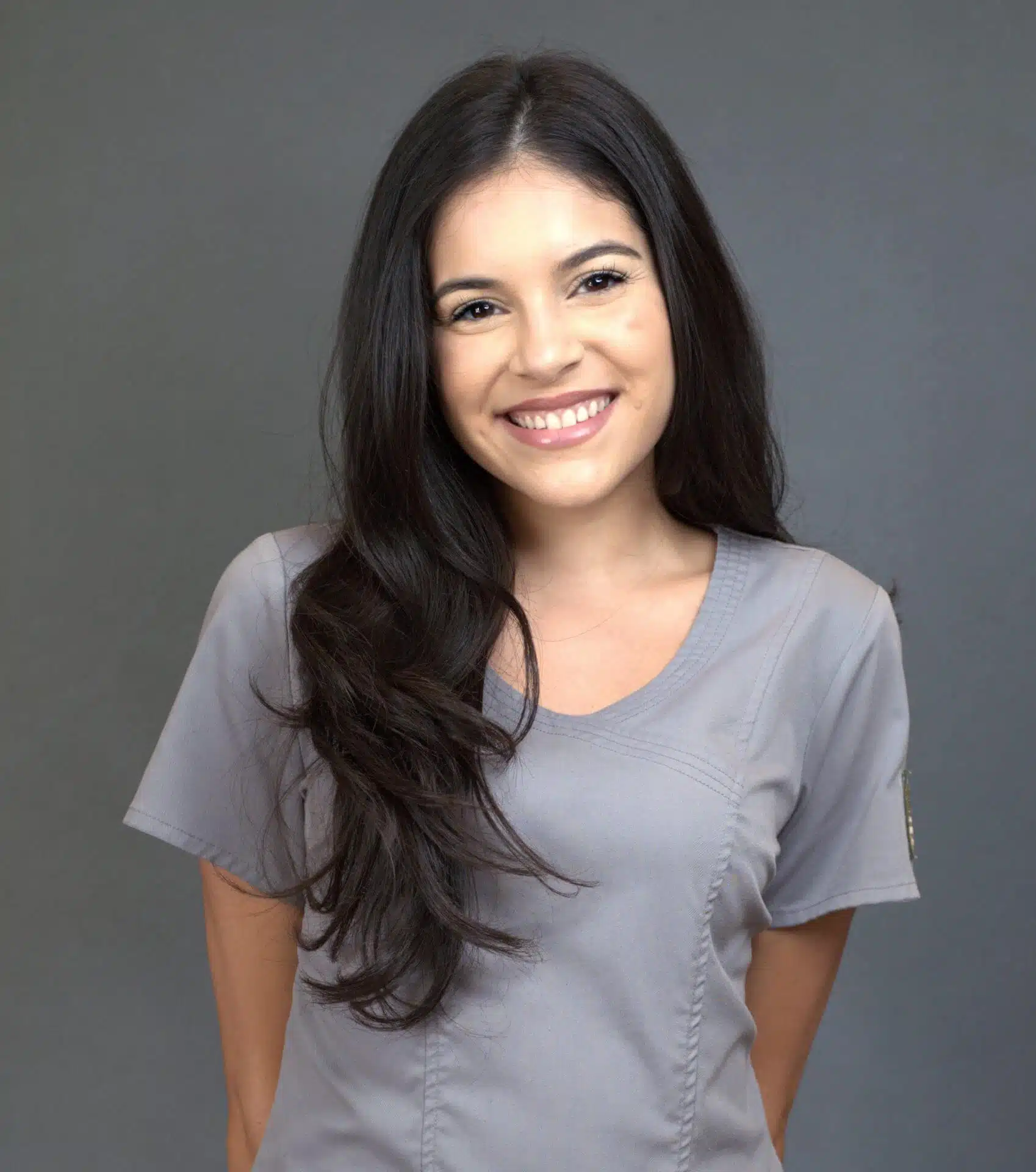 Smiling dental hygienist at Southern Style Dental in professional attire ready to assist patients.