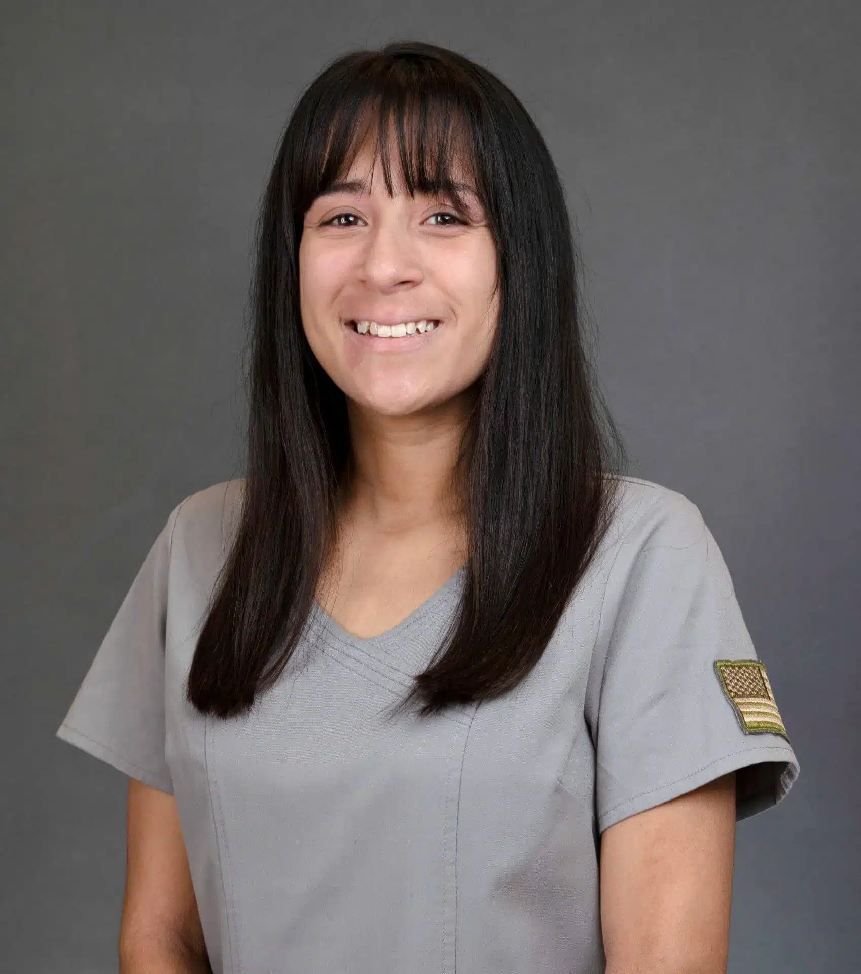 Southern Style Dental staff member smiling, showcasing professional dental care in a modern dental office.
