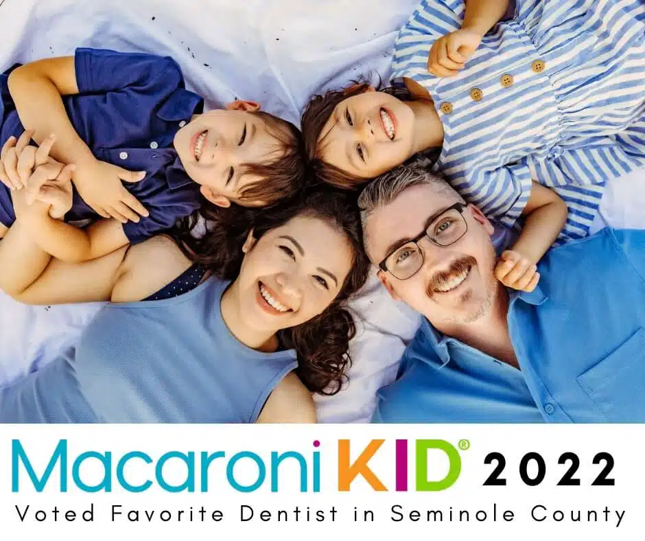Southern Style Dental family smiling, voted Favorite Dentist in Seminole County 2022 by Macaroni Kid.