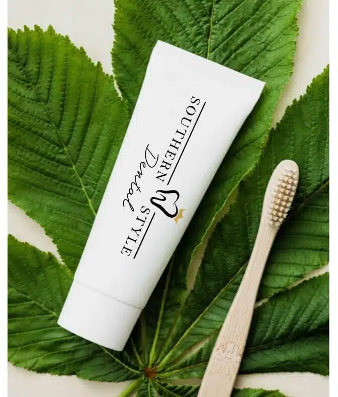 Tube of toothpaste with Southern Style Dental logo next to a bamboo toothbrush; Southern Style Dental website banner.