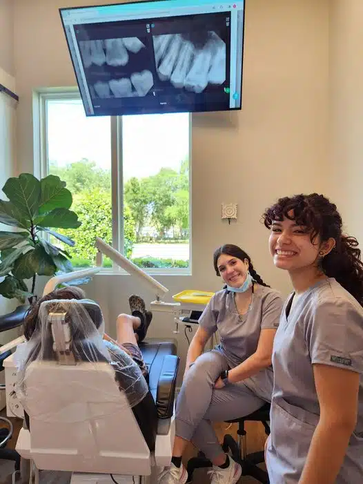 Southern Style Dental team at work with a patient, showcasing advanced dental care. Bright, welcoming treatment room.